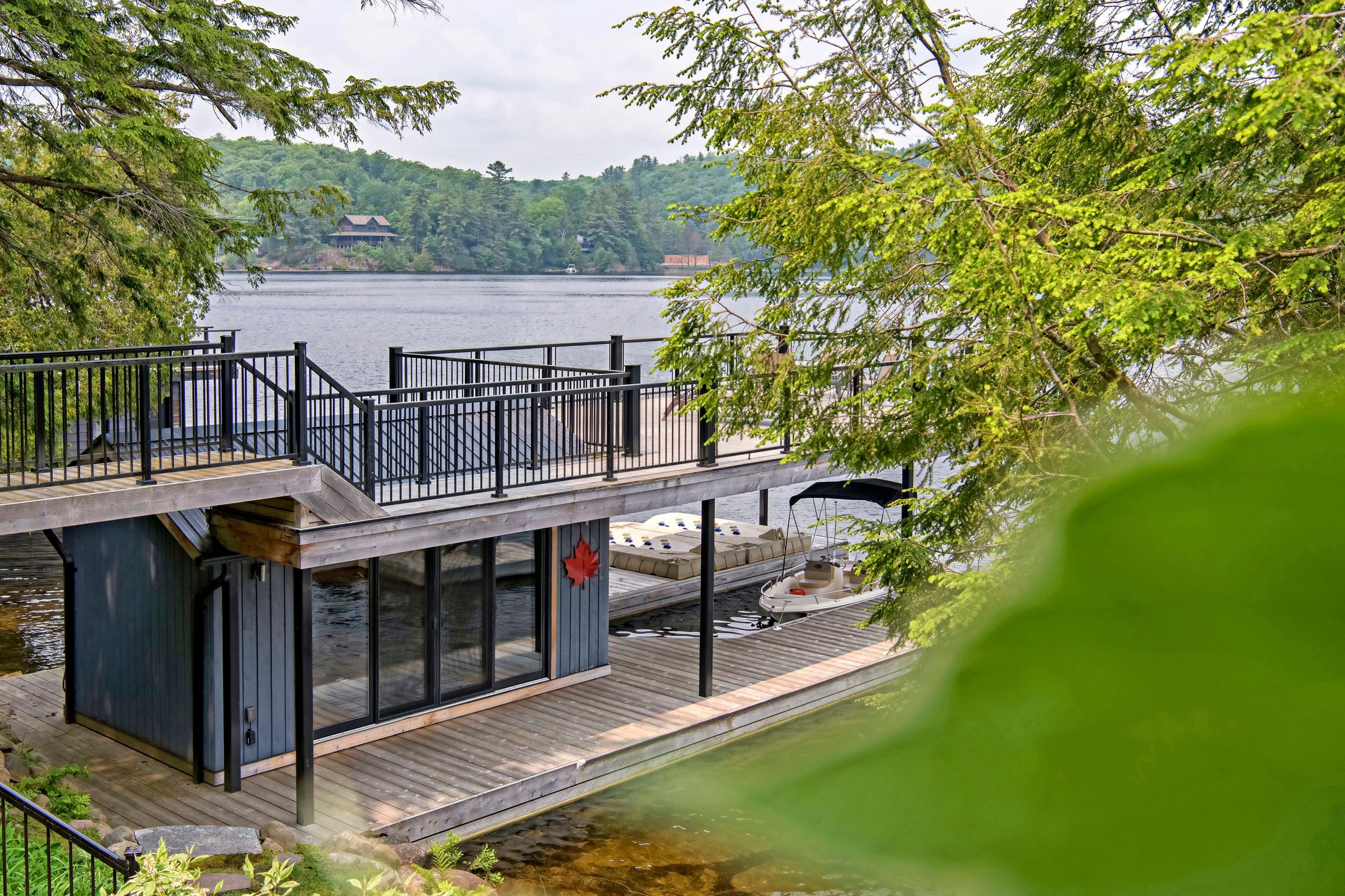 Two kayaks, a paddleboard, a boat port